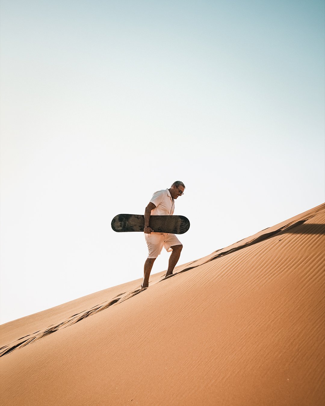 Sandboarding in desert